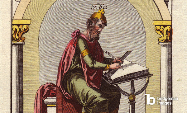 Portrait of Wulfstan, second arch of York from 1002-1023, A copy of an 11th century manuscript, dressed in his ordinary dress, sitting and studying a book in his office. Hand-coloured copper engraving, in “Images historiques des costumes des principaux peuples de l'Antiquite et du Middle Ages” by Robert Von Spalart