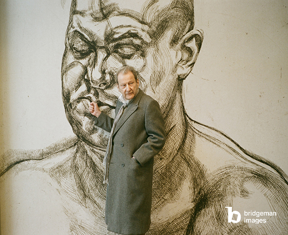 Lucian Freud in front of a blown up version of one of his etchings at the Museum of Modern Art