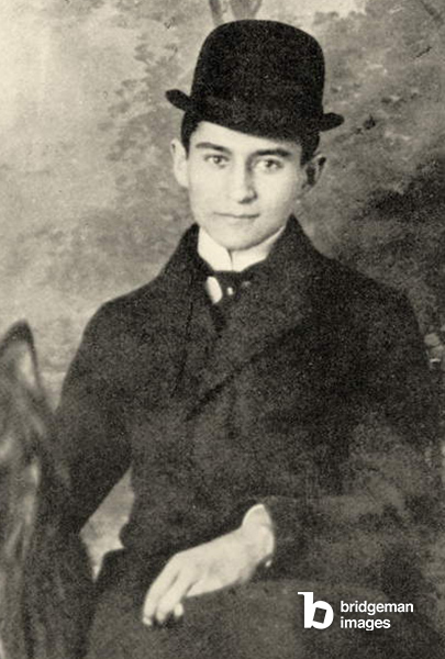 Franz Kafka with his dog, 1910 (b/w photo), Czech School, (20th century) / Private Collection / Prismatic Pictures / Bridgeman Images