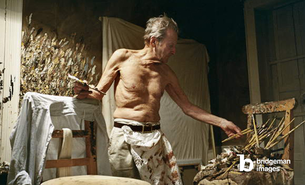 photo of Lucian Freud at work in his studio.